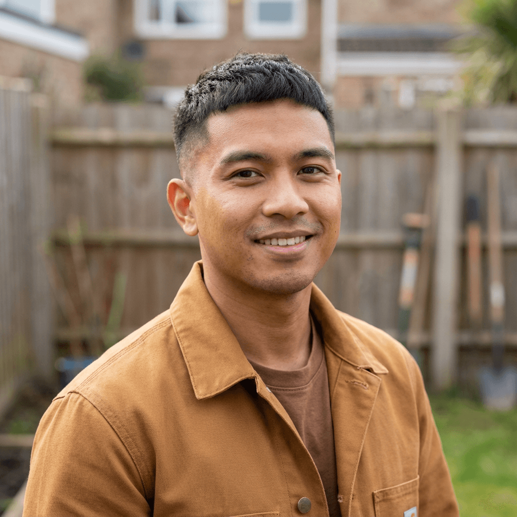 Male contractor in his late 20s, White, professional work attire, at a construction site